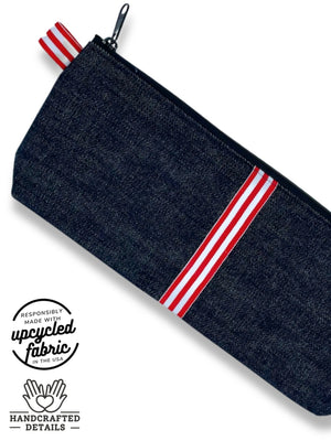 fabric detail of adult toy storage pouch dark midnight denim with red and white ribbon accent , made in USA by Quiver.Love